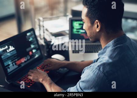 Man, typing and programmer on laptop in office workplace for data, analysis or statistics. IT, computer and male coder, engineer or person programming Stock Photo