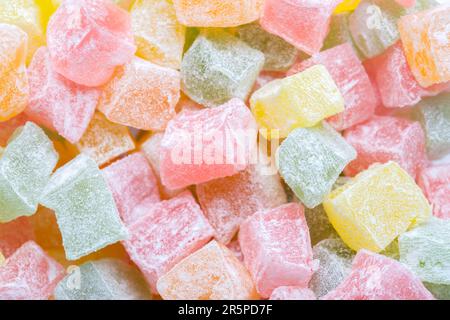 Closeup of multicolored cubes Turkish delight (Lokum). Selective Focus. Flat lay. Stock Photo