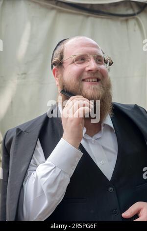 In a synagogue in Monsey, NY, an orthodox Jewish man leads the ...