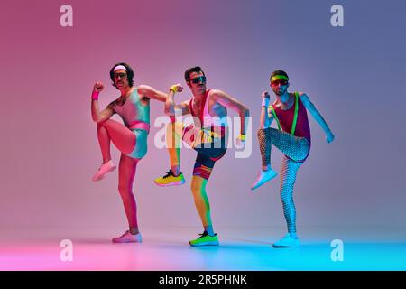 Funny image of three men in stylish, vintage sportswear training