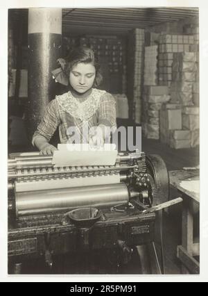 Young Worker in Paper Box Factory Date: 1912 Artist: Lewis Wickes Hine American, 1874–1940 Stock Photo