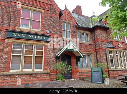 Exterior of the Saracens Head public house on Wilderspool Causeway, Warrington, a traditional Victorian red-brick pub operated by JW Lees brewery Stock Photo