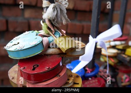 Many old different love locks on the fence Stock Photo