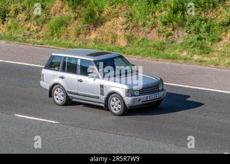 2004 Silver Land Rover Range Rover Vogue V8 Auto, V8 Auto Car SUV Petrol 4398 cc; travelling on the M61 motorway highway network. Stock Photo