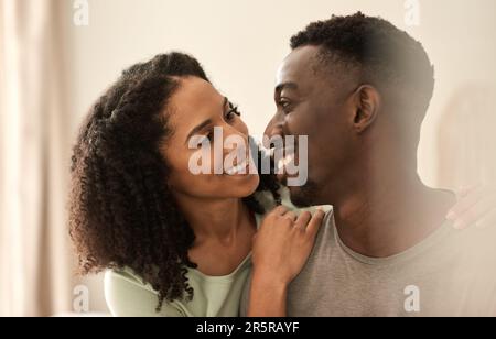 Loving multiracial couple looking at each other and smiling Stock Photo