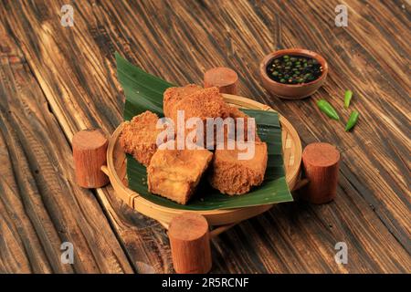 Tahu Sumedang with Sambal Kecap. Popular Street Food of Deep Fried Bean Curd Tofu from Sumedang, West Java. Stock Photo