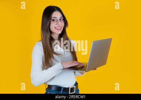 portrait of nice attractive caucasian woman holding laptop. Young beautiful businesswoman, office worker, designer, coder, copy writer. Stock Photo