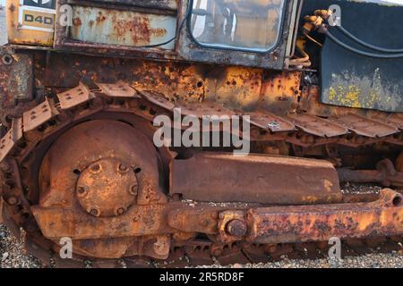 Caterpillar tractor for pulling up fishing boats from the sea, Aldeburgh, Suffolk, UK Stock Photo