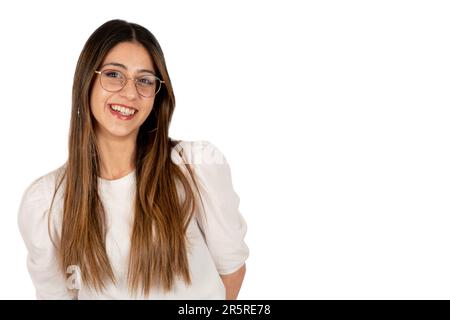 Casual woman, portrait of smiling casual woman. Friendly caucasian brunette long hair 20s girl. Wearing glasses, white shirt, looking camera posing. Stock Photo