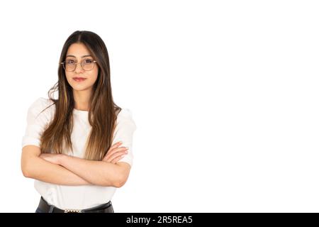 Portrait of young woman, standing over isolated white background portrait of young woman. Pretty, smiling, arms crossed, positive, lovely, beautiful. Stock Photo