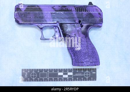 Purple swirled Hi-Point pistol Stock Photo