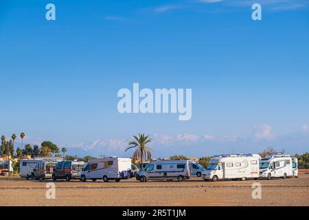 Morocco, Marrakesh, imperial city, the medina (UNESCO World Heritage Site), motorhome area near the ramparts, the snow-covered Atlas in the background Stock Photo