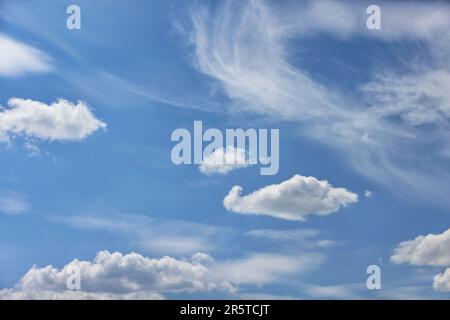 Blue sky background with white clouds, floating on blue sky. Stock Photo