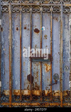 Rusty iron door detai in a street of Lisbon Stock Photo