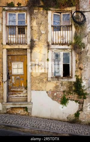 Facade of a derelict terraced house in Lisbon Stock Photo