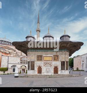 Fountain of Sultan Ahmed III, aka Ahmet Cesmesi, a 17th century public Turkish rococo water fountain, or Sabil, located in the Great Square, near the Imperial Gate of Topkapi Palace, Istanbul, Turkey Stock Photo