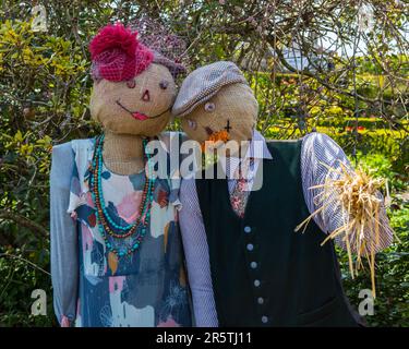 Sussex, UK - April 29th 2023: Two Scarecrows in the gardens at Arundel Castle in Arundel, West Sussex. Stock Photo