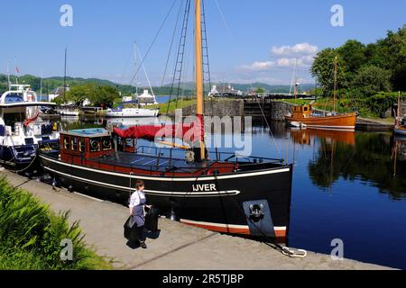 Crinan, Scotland, UK. 5th June 2023.  Glorious warm and sunny weather continues on the west coast, people enjoying the outdoors in an attractive setting with the scenic villages along the coast.  Crinan canal basin.   Credit: Craig Brown/Alamy Live News Stock Photo