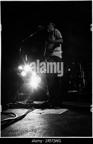 BOB MOULD, SUGAR, COPPER BLUE TOUR, 1992: Bob Mould from legendary grunge band Sugar on their Copper Blue Tour at Cardiff University on 17 December 1992. Photograph: Rob Watkins.  INFO: Sugar, an American alternative rock band formed in 1992 in Athens, Georgia, by Bob Mould, gained acclaim for their blend of punk energy and melodic hooks. Hits like 'If I Can't Change Your Mind' and 'Helpless' cemented their status as '90s indie rock icons. Stock Photo