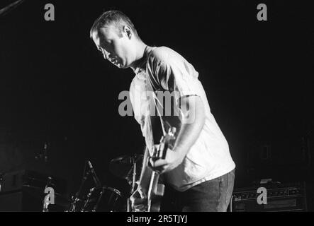 BOB MOULD, SUGAR, COPPER BLUE TOUR, 1992: Bob Mould from legendary grunge band Sugar on their Copper Blue Tour at Cardiff University on 17 December 1992. Photograph: Rob Watkins.  INFO: Sugar, an American alternative rock band formed in 1992 in Athens, Georgia, by Bob Mould, gained acclaim for their blend of punk energy and melodic hooks. Hits like 'If I Can't Change Your Mind' and 'Helpless' cemented their status as '90s indie rock icons. Stock Photo