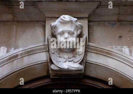 London, UK - April 20th 2023: Sculpture on the exterior of St. Mary Abchurch, in the City of London, UK - built by Sir Christopher Wren in the late 18 Stock Photo