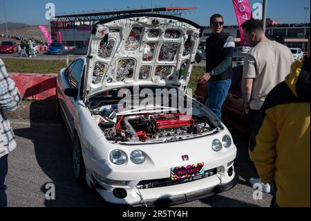 Detail of a third generation white Honda Integra with the hood open ...