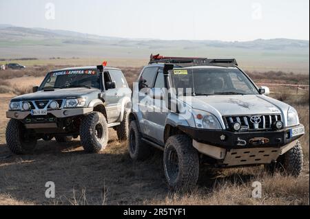 Detail of a couple of SUVs modified in the mountains, a Toyota Land Cruiser J120 and a Nissan Patrol GR Stock Photo