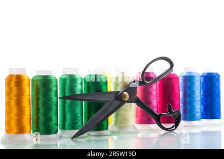 set of different color sewing threads, isolated on white background. Stock Photo