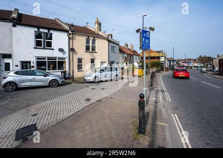 Signs on Bedminster Down Road mark the entrance to a 'home zone' traffic calmed neighbourhood of terraced houses in Bristol. Stock Photo