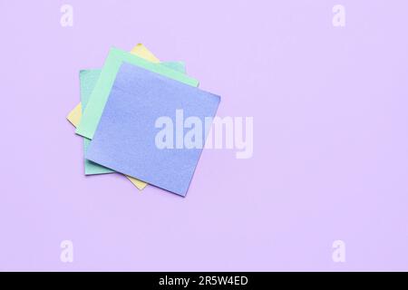 Sticky notes on violet background. Update concept Stock Photo