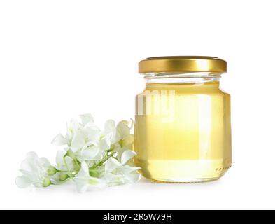 Jar of honey with flowers of acacia on white background Stock Photo