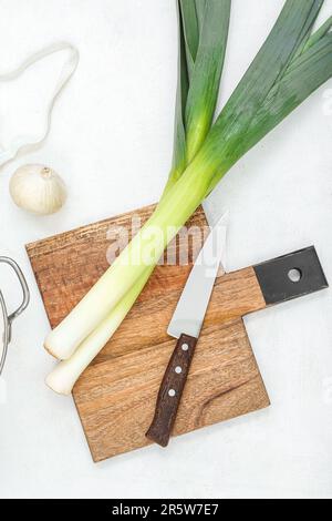Board with different kinds of onion on grunge black background Stock ...