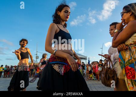 Salvador, Bahia, Brazil - October 22, 2022: Street performers are seen during a belly dancing performance at Farol da Barra, in Salvador, Bahia. Stock Photo