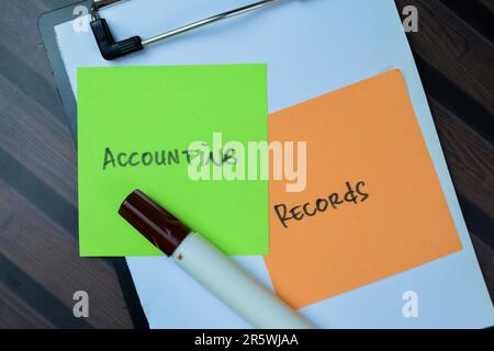 Concept of Accounting Records write on sticky notes isolated on Wooden Table. Stock Photo