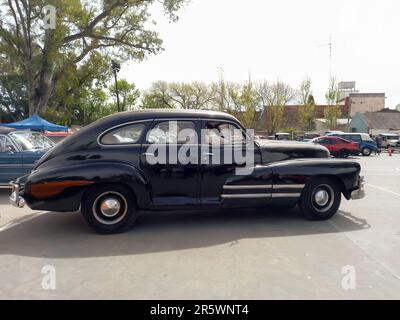 Lanus, Argentina - Sept 25, 2022: Old black 1940s Buick Eight Special four door sedan by GM in a park. AAA 2022 classic car show. Stock Photo