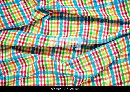 Wrinkled texture material rag. Colorful fabric background checkered. Stock Photo