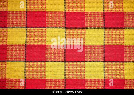Texture material rag. Red and yellow fabric background checkered. Stock Photo