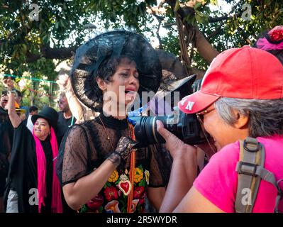 Barranquilla, Atlantico, Colombia - February 21 2023: Colombian Woman Dressed in Black is Crying Because the Carnival is Over Stock Photo