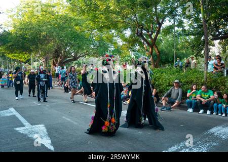 Barranquilla, Atlantico, Colombia - February 21 2023: Colombian Dress in Black with Mask, Walk Down Parade Street on the Last Day of Carnival Stock Photo