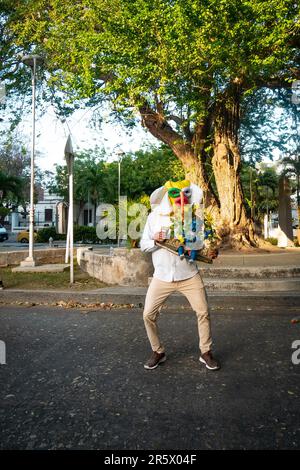 Barranquilla, Atlantico, Colombia - February 21 2023: Colombian Dressed as the Main Character of the Carnival Known as 'Marimonda' Poses in Front of t Stock Photo