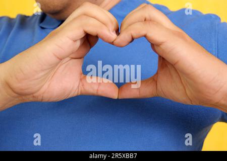 Hands of a Latino man makes sign language, expression and gesture-spatial configuration and visual perception with which deaf people Stock Photo