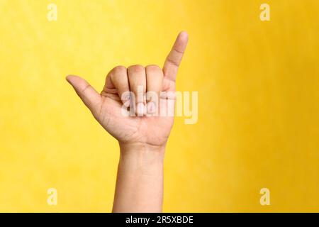 Hands of a Latino man makes sign language, expression and gesture-spatial configuration and visual perception with which deaf people Stock Photo