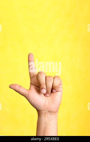 Hands of a Latino man makes sign language, expression and gesture-spatial configuration and visual perception with which deaf people Stock Photo