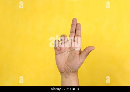 Hands of a Latino man makes sign language, expression and gesture-spatial configuration and visual perception with which deaf people Stock Photo