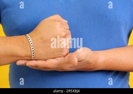 Hands of a Latino man makes sign language, expression and gesture-spatial configuration and visual perception with which deaf people Stock Photo