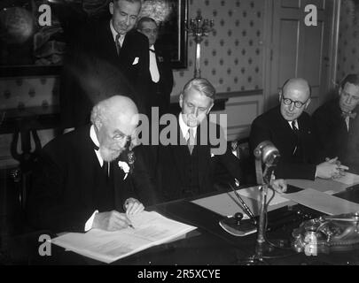 The Marshall Plan agreement between Holland and the USA being signed at The Haugue in 1948. The Marshall Plan was a very ambitious financial aid program proposed by US Secretary of State George Marshall. He understood that a destroyed and prostrate Europe had to have financial help if it were to recover and to remove the threat of communist insurgency. The aid was given not lent and each country decided on how it would use the funds. In the three years of the program the US gave Europe $13 billion, a colossal sum worth $175 billion at todays values. This far-seeing and generous plan was a majo Stock Photo