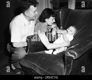 French parents with their baby whose life has been saved by Streptomycin antibiotic funded with Marshall Plan money. The Marshall Plan was a very ambitious financial aid program proposed by US Secretary of State George Marshall. He understood that a destroyed and prostrate Europe had to have financial help if it were to recover and to remove the threat of communist insurgency. The aid was given not lent and each country decided on how it would use the funds. In the three years of the program the US gave Europe $13 billion, a colossal sum worth $175 billion at todays values. This far-seeing and Stock Photo