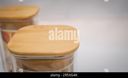 Wooden Lid Jars offer a natural and rustic storage solution that blends in well. These jars come with wooden lids that help to keep the contents fresh Stock Photo