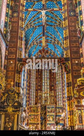 Altar Crucifix Croww Ceiling Triptych St Mary's Basilica Church Krakow Poland. Buit first in 1300s and the interior in 1700s Stock Photo