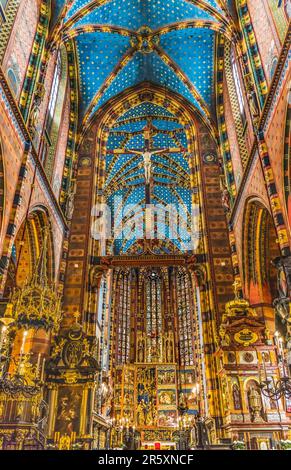 Altar Crucifix Croww Ceiling Triptych St Mary's Basilica Church Krakow Poland. Buit first in 1300s and the interior in 1700s Stock Photo